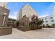 Modern brick building with landscaped grounds and parking at 163 S Harrison St, Denver, CO 80209