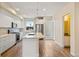 Modern kitchen with island and stainless steel appliances at 163 S Harrison St, Denver, CO 80209