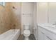 Updated bathroom with tub, toilet and double vanity at 163 S Harrison St, Denver, CO 80209