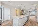 Modern kitchen with large island and stainless steel appliances at 163 S Harrison St, Denver, CO 80209