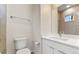 Modern bathroom with tile shower, vanity, and toilet at 163 S Harrison St, Denver, CO 80209