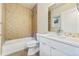 Bathroom with a bathtub, toilet and modern vanity at 163 S Harrison St, Denver, CO 80209