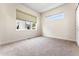 Bright bedroom with neutral carpeting and large windows at 163 S Harrison St, Denver, CO 80209