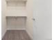 Walk-in closet with double hanging rods and shelves at 163 S Harrison St, Denver, CO 80209