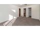 Bright bedroom with carpeting and an ensuite bathroom at 818 S Terry St # 85, Longmont, CO 80501