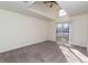 Spacious bedroom with a ceiling fan and access to a private balcony at 818 S Terry St # 85, Longmont, CO 80501