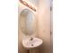 Simple bathroom featuring a pedestal sink and an oval mirror at 818 S Terry St # 85, Longmont, CO 80501