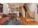 Virtually staged living room with hardwood floors at 818 S Terry St # 85, Longmont, CO 80501