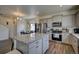 Modern kitchen with granite countertops and stainless steel appliances at 45780 Silverdrop Ave, Bennett, CO 80102