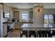 Modern kitchen with granite countertops and stainless steel appliances at 45780 Silverdrop Ave, Bennett, CO 80102