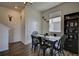 Charming dining room with farmhouse table and black metal chairs at 45780 Silverdrop Ave, Bennett, CO 80102