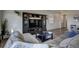 Spacious living room featuring a large TV stand and comfortable seating at 45780 Silverdrop Ave, Bennett, CO 80102