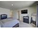 Bright bedroom with large TV and dresser at 45780 Silverdrop Ave, Bennett, CO 80102