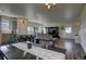 Open concept dining area with view into the living room at 45780 Silverdrop Ave, Bennett, CO 80102