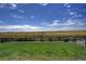 Large backyard with grassy area and wood fence at 45780 Silverdrop Ave, Bennett, CO 80102