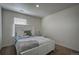 Spacious bedroom with a queen-size bed and window coverings at 45780 Silverdrop Ave, Bennett, CO 80102