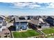 Aerial view of house with solar panels and yard at 45780 Silverdrop Ave, Bennett, CO 80102