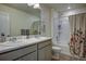 Bathroom with double vanity, bathtub, and shower at 45780 Silverdrop Ave, Bennett, CO 80102
