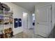 Hallway with shoe storage and access to bedrooms at 45780 Silverdrop Ave, Bennett, CO 80102