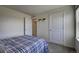 Bright bedroom with carpeted floor and large window at 45780 Silverdrop Ave, Bennett, CO 80102