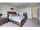 Bedroom with wood platform bed and access to hall at 45780 Silverdrop Ave, Bennett, CO 80102