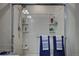 Shower with glass enclosure and built in shelves at 45780 Silverdrop Ave, Bennett, CO 80102