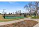 Two community tennis courts with surrounding landscaping at 10395 Red Mountain E, Littleton, CO 80127