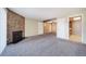 Open living room with fireplace and adjacent kitchen at 12113 Melody Dr # 304, Westminster, CO 80234