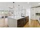 Modern kitchen with a large island and breakfast bar at 4233 Vallejo St, Denver, CO 80211