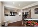 Game room with a view into the living room and staircase at 13351 Olive Way, Thornton, CO 80602