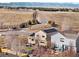 Aerial view of house and neighborhood with mountain views at 3944 Morning Glory Dr, Castle Rock, CO 80109