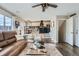 Open concept living room with kitchen view at 3944 Morning Glory Dr, Castle Rock, CO 80109