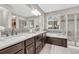 Elegant bathroom with double vanity, soaking tub, and shower at 10527 Skyreach Rd, Highlands Ranch, CO 80126