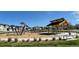 Community playground with modern equipment and covered seating at 708 N Bently St, Watkins, CO 80137