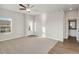 Spacious living room with carpeted floor and access to a bathroom at 3012 Oxley St, Strasburg, CO 80136