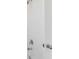 Clean shower with white tile surround at 3012 Oxley St, Strasburg, CO 80136