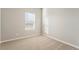 Bright bedroom with neutral walls and carpet flooring at 3012 Oxley St, Strasburg, CO 80136