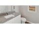 Simple bathroom with toilet and vanity at 3012 Oxley St, Strasburg, CO 80136