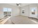Living Room with sliding glass doors and wood-look floors at 3012 Oxley St, Strasburg, CO 80136