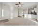 Spacious living room, open concept with kitchen at 3012 Oxley St, Strasburg, CO 80136