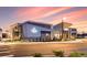 Modern community center with stone and glass exterior at dusk at 4583 Boone Cir, Brighton, CO 80601