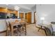 Cozy dining area with a table and chairs, adjacent to kitchen at 34 Highfield Trl # 203, Breckenridge, CO 80424