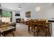 Bright living room with fireplace, dining area, and access to a deck at 34 Highfield Trl # 203, Breckenridge, CO 80424