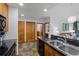 Modern kitchen with stainless steel appliances and granite counters at 34 Highfield Trl # 203, Breckenridge, CO 80424