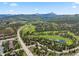 Aerial view showcasing surrounding mountain views and golf course at 34 Highfield Trl # 203, Breckenridge, CO 80424