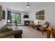 Living room with fireplace and access to outdoor deck at 34 Highfield Trl # 203, Breckenridge, CO 80424