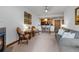 Spacious living area featuring a fireplace and adjacent kitchen at 34 Highfield Trl # 203, Breckenridge, CO 80424