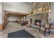 Spacious lobby with stone fireplace and comfortable seating at 34 Highfield Trl # 203, Breckenridge, CO 80424