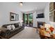 Comfortable living room featuring a fireplace and sliding glass doors to deck at 34 Highfield Trl # 203, Breckenridge, CO 80424