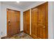Bright entryway with wood doors and tile flooring at 34 Highfield Trl # 203, Breckenridge, CO 80424
